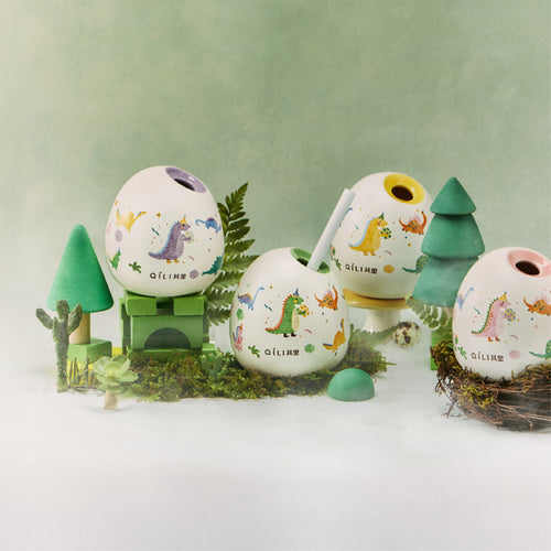 Dinosaur reed diffuser set with painted globe tops, reeds, and decorative trees
