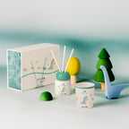 Dinosaur scent diffuser set with reed sticks, small jar, and decorative dinosaur
