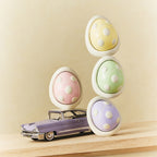 Car diffuser egg scent pods in pastel yellow, green, and purple with white holder