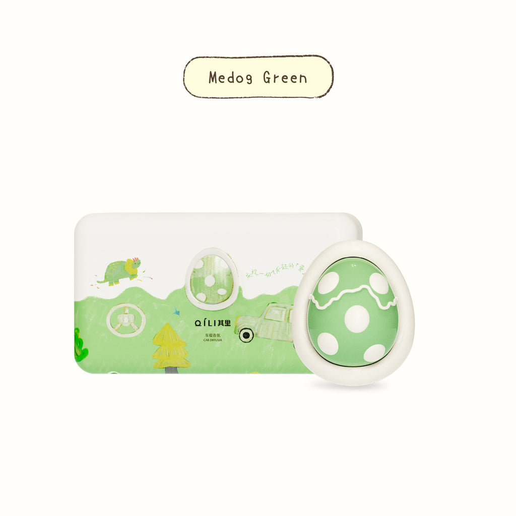 Car diffuser with white dinosaur-style tray and green egg-shaped scent pod, Medog Green