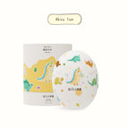 Aksu Sun dinosaur egg scented candle with colorful dino pattern on round container