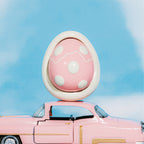 Pink egg-shaped car diffuser scent pod with white rim