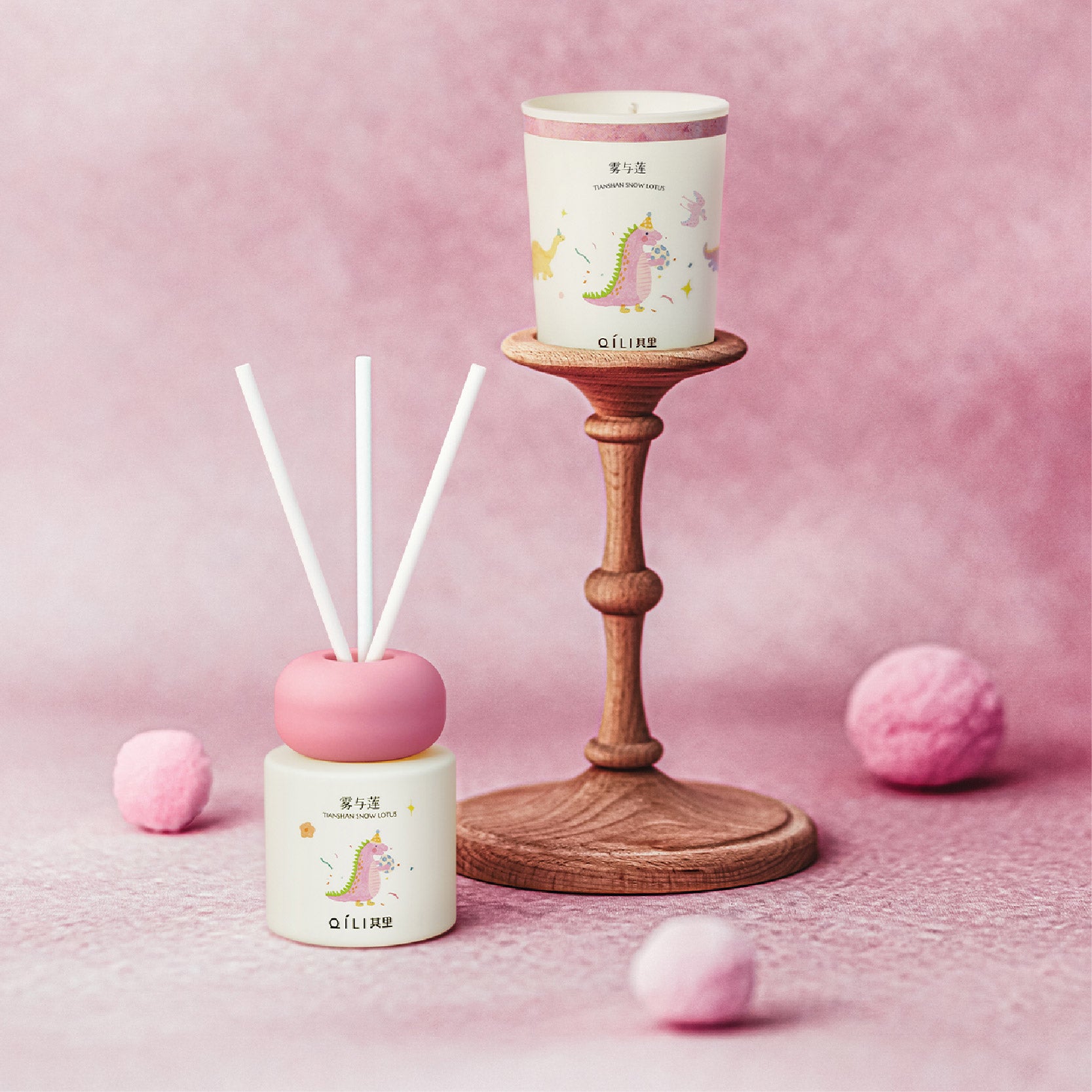 Dinosaur scent diffuser set with pink base jar, candle jar, and reed sticks