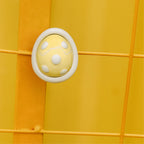 Yellow egg-shaped car diffuser scent pod on yellow panel